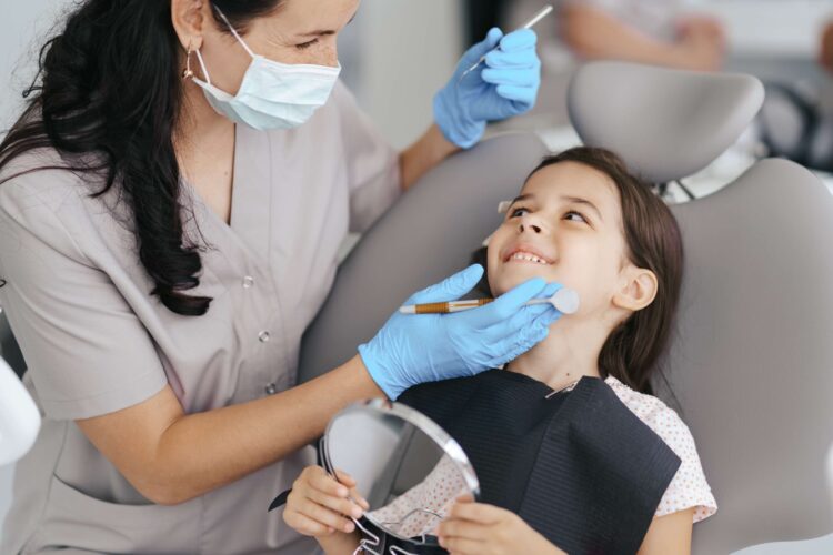 little-beautiful-girl-dentist-smiling-1